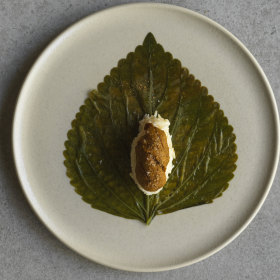 Salted sesame leaf with sea urchin.