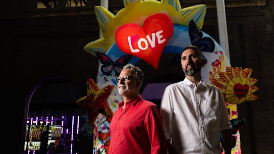 Artists Maurice Goldberg (left) and Matthew Aberline (right) with their artwork, ‘Fabulous: Acts of Protest and Celebration’.