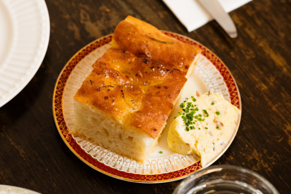 Focaccia with onion butter that uses onion in three different forms.