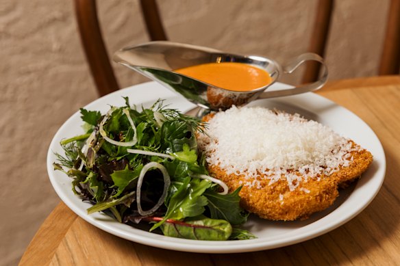 Chicken schnitzel with parmesan and vodka-tomato sauce.