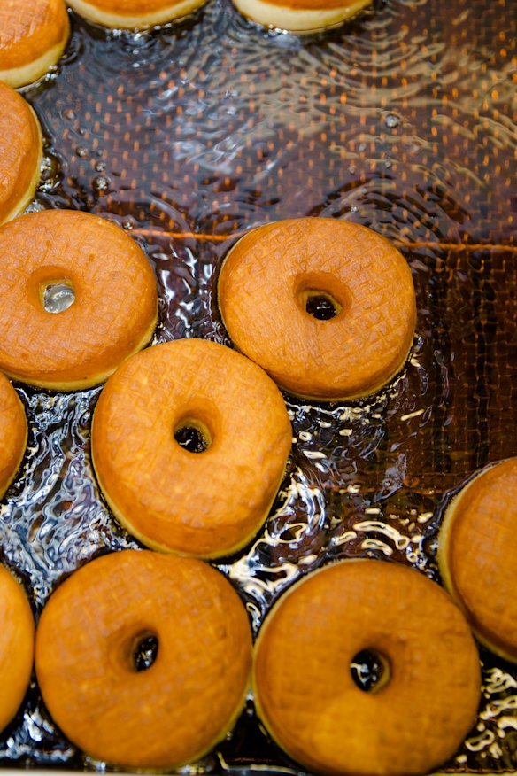 Hot doughnuts in oil. 