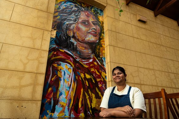 Ahana Dutt with a mural of her mother. 