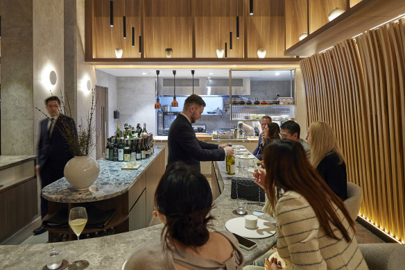 Allta’s timber slats arch over diners like a blond wood Hokusai wave.