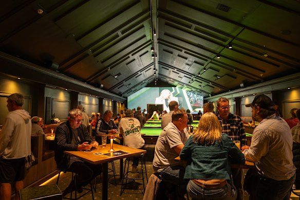 Catch the game on the “super duper” big screen. 