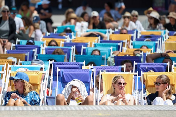 Fans enjoying the warm weather in the deck chairs on Garden Square.