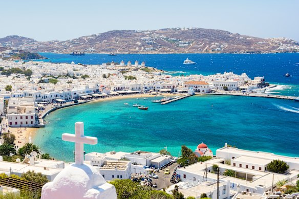 Mykonos town is a pretty Greek-island cliché of whitewashed cubic buildings and domed churches.