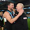 Travis Boak of the Power and Ken Hinkley hug after their final game together.
