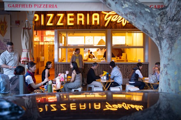 Footpath seating makes up most of the dining real estate at Garfield Pizzeria on Lygon Street.