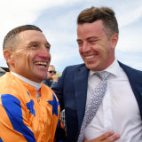 Opie Bosson celebrates in Te Akau silks with trainer Jamie Richards.