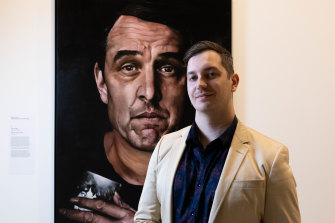 Artist Jeremy Eden and his portrait of actor Samuel Johnson.