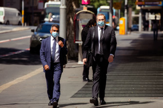 Michael Toohey, right, arriving at ICAC on Monday.