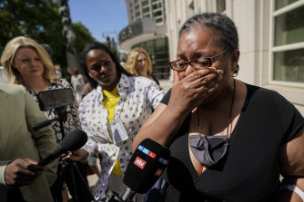 A supporter of R. Kelly cries outside court following the sentencing.