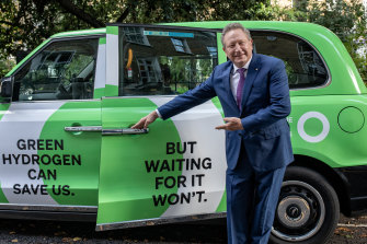 Fortescue boss Andrew Forrest with one of his climate campaign cabs in London.