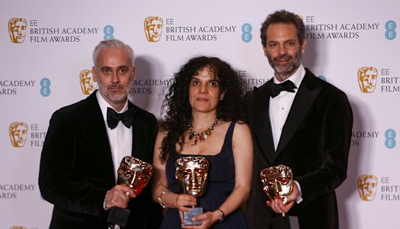 Australia’s Emile Sherman (right) with fellow producers Iain Canning and Tanya Seghatchian with the best film award for The Power of the Dog at the BAFTAS.