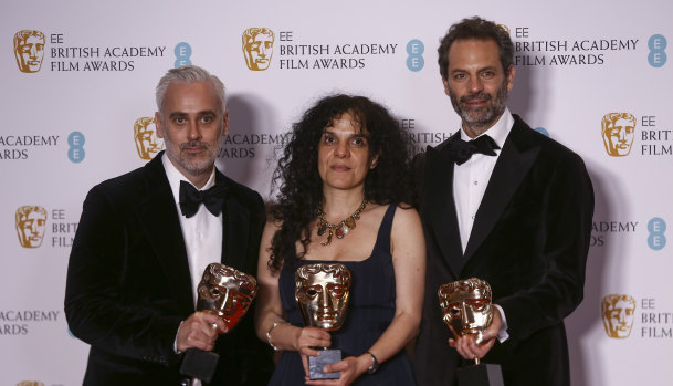 Australia’s Emile Sherman (right) with fellow producers Iain Canning and Tanya Seghatchian with the best film award for The Power of the Dog at the BAFTAS.