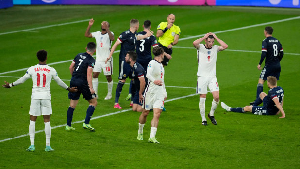 England’s Declan Rice (white shirt, right) reacts after missing a chance during the clash with Scotland.