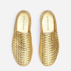 Marie du Petit Thouars is enjoying her gold Bottega Veneta “Sunday” slippers.