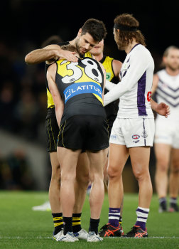 Noah Cumberland is consoled by former Richmond captain Trent Cotchin.
