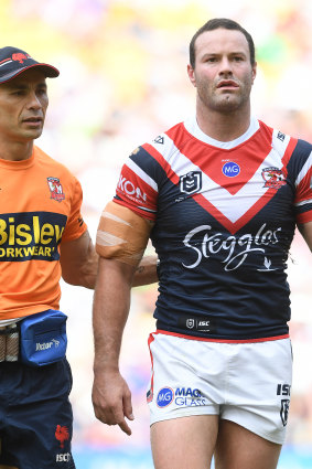 Lights on, nobody home: Boyd Cordner is escorted off the field against Canberra.