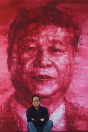 Adam Chang in front of his Xi Jinping painting. 