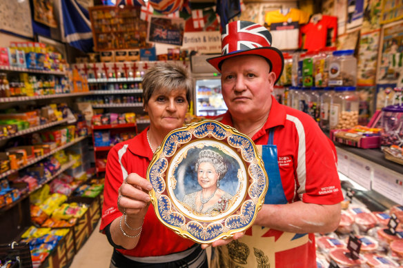 Jill and Rob Boyle with a plate portrait of the Queen at their British butchery in Dandenong.