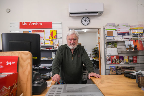 Postmaster Chris Horton whose business is powered mostly by solar energy.