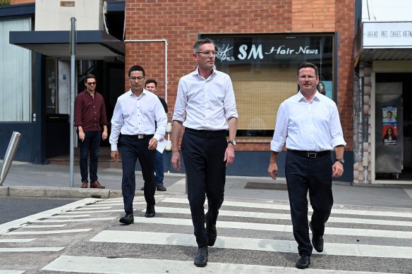 Premier Dominic Perrottet (centre) campaigning in Peakhurst on Friday with Kogarah candidate Craig Chung, left, and Minister for Seniors Mark Coure.