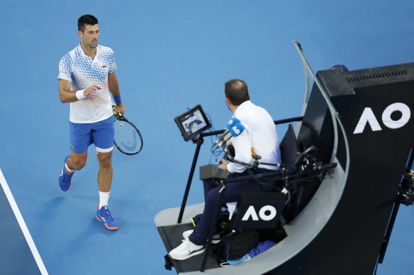 Djokovic takes on the umpire.