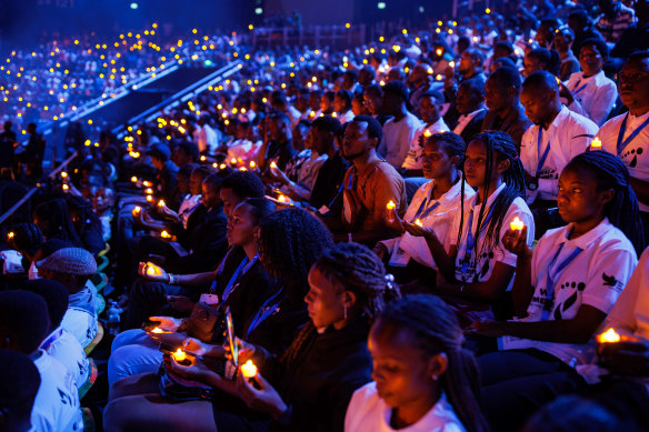 Young Rwandans take part in a vigil on the first of 100 days of remembrance of the genocide on April 7, 2024, in Kigali. 