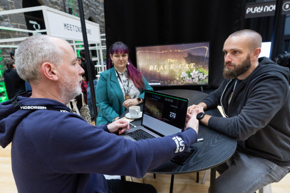 Devolver’s Daniel Lucic, right, travelled from Croatia to see what Australia’s games developers had to offer. Alan Downie, left, hoped he might entice him with his Edgar Allan Poe-inspired game The Black Cat.