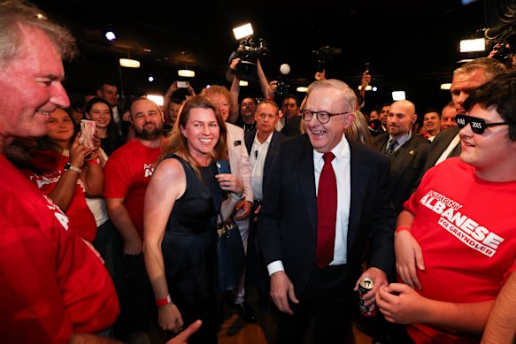 Anthony Albanese walks through a crowd of Labor supporters on election night after claiming an emphatic victory.
