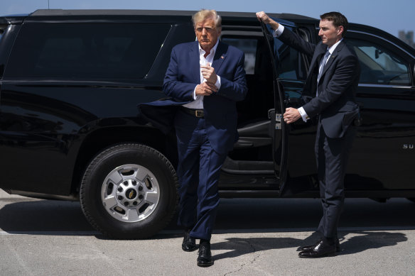 Former President Donald Trump arrives to board his airplane.