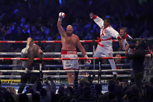 Fury celebrates after knocking out Dillian Whyte.