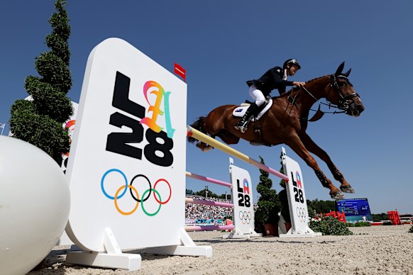 Christopher Burton and horse Shadow Man leap towards a silver medal for Australia in Paris last year.