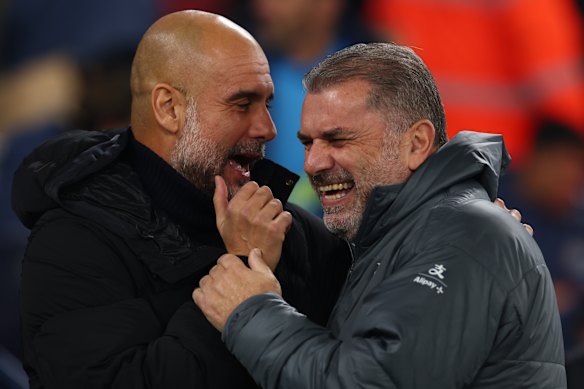 Pep Guardiola and Ange Postecoglou share a joke.