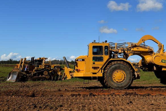 Giant scrapers undertake major earthworks on the airport site at Badgerys Creek.