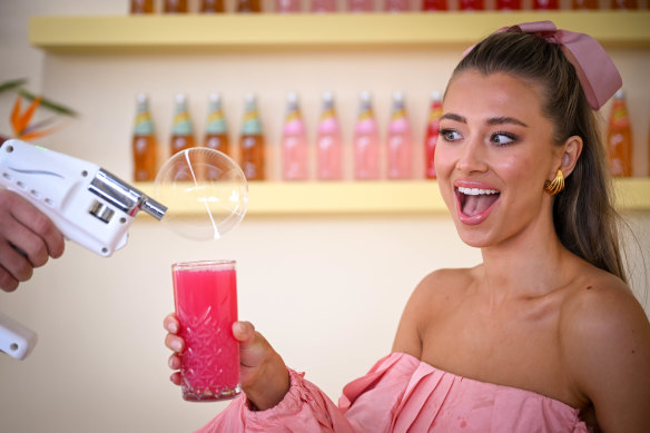 Model Tess Shanahan enjoys the magical bubble booth in the Schweppes marquee.