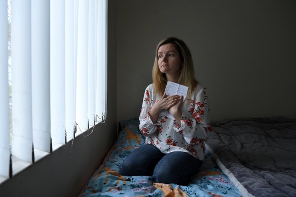 Anna-Mariia Mykytiuk holds a letter from her friend, Tatiana, a maths teacher shot dead by a Russian sniper. 