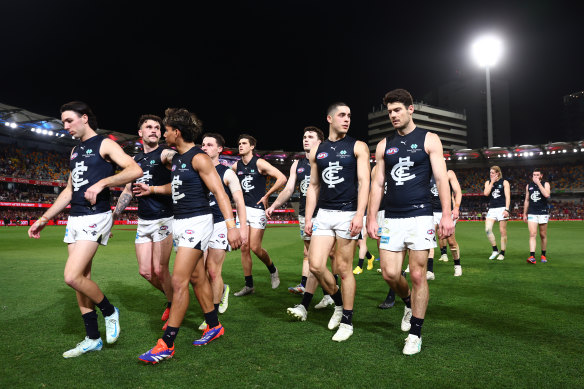 A disappointed and disappointing Carlton leave the ground after being eliminated from finals
