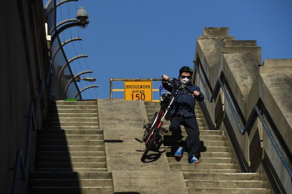 Les Szancer, 73, makes his way down the steps.