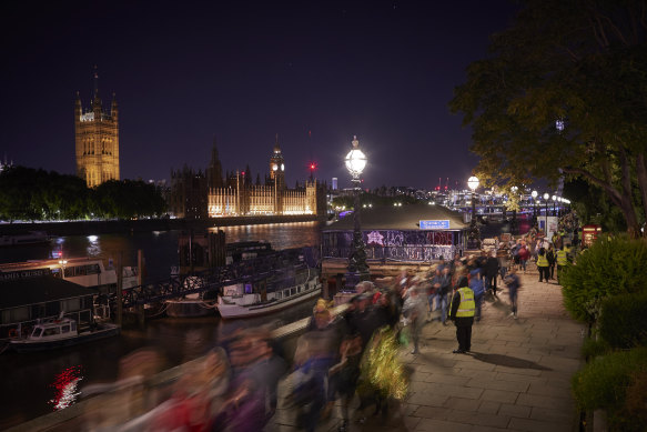 Mourners slowly move along the River Thames to view the coffin of Queen Elizabeth II at Westminster Hall before her funeral on Monday.