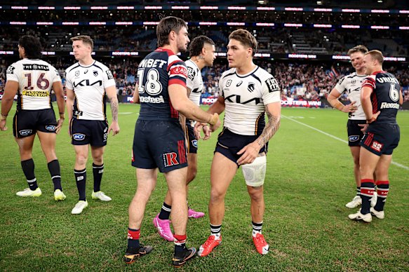 Ramsey and Broncos star Reece Walsh shake hands.