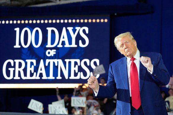 US President Donald Trump at a rally in Michigan to mark 100 days in office.