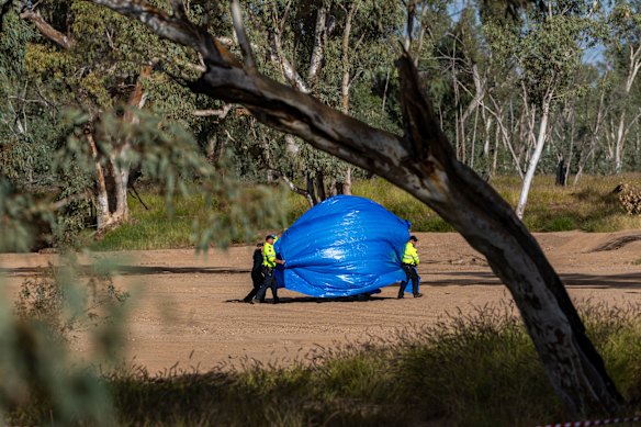Police at the scene where missing five-year-old Kumanjayi Little Baby was discovered on Thursday.