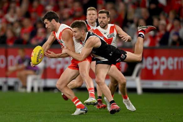 Robbie Fox is tackled by Dan Butler.