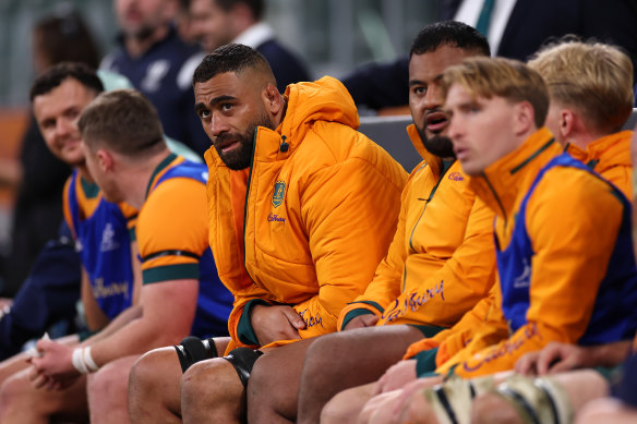 The Wallabies bench looks on. 