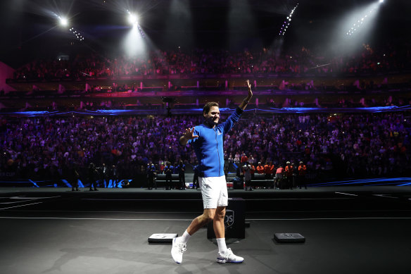 Roger Federer acknowledges the crowd after his final tennis match.