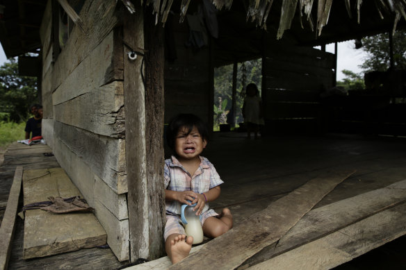 A boy from the Ngabe Bugle indigenous group at his home in the community of El Terron, Panama.