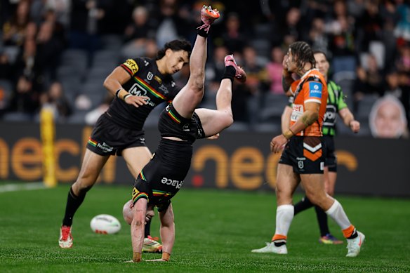 Panthers fullback Dylan Edwards celebrates a try against Wests Tigers last July.