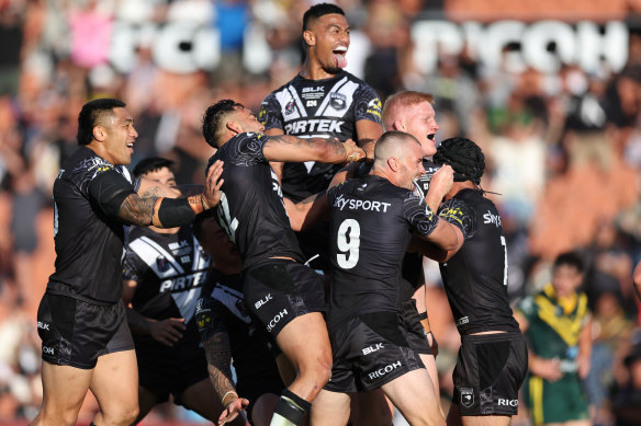 The Kiwis celebrate a try during their 30-0 defeat of Australia in the Pacific Championships final.